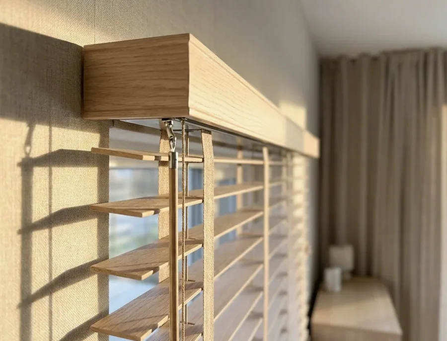 Timber venetian blind headrail, ladder tapes and tilt mechanism being serviced